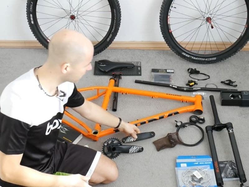 A man assembling bike parts