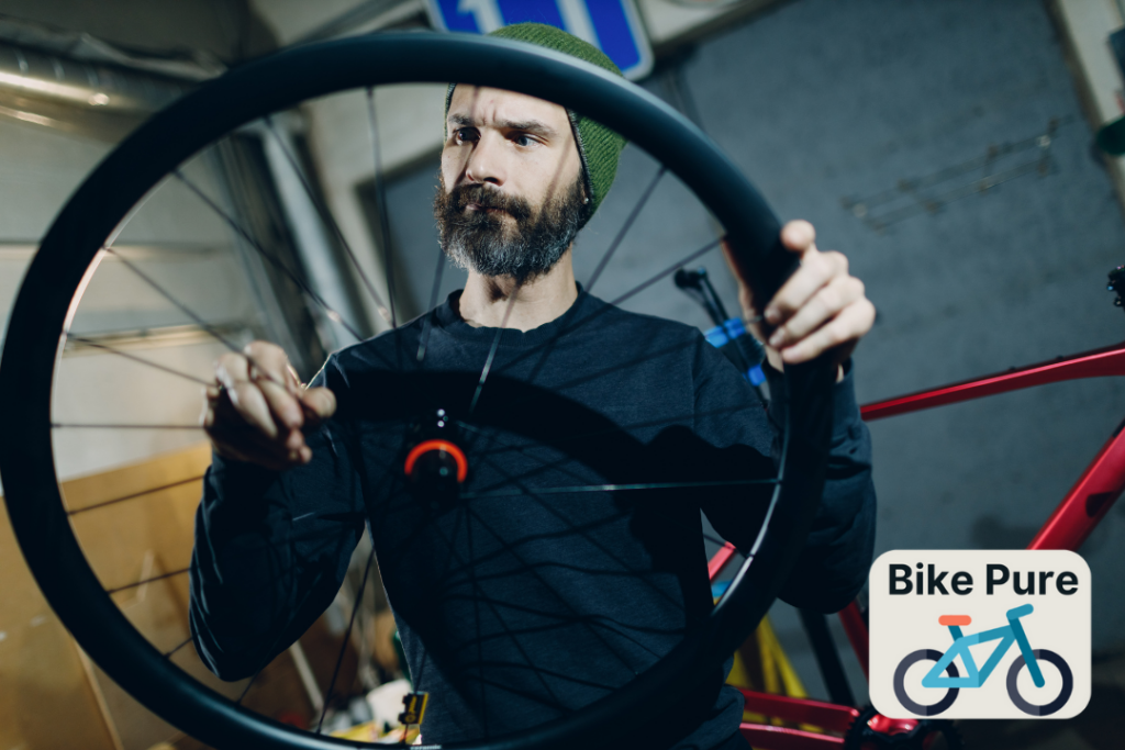 A picture of a man inspecting his bike tire