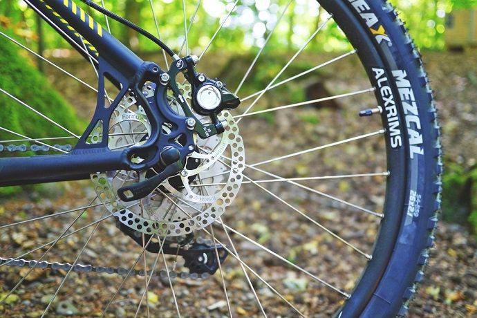 image of a mountain bike rear wheel in a forest